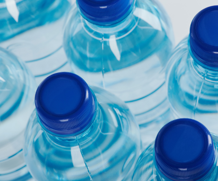 Group of blue plastic bottles above top view close up<br />